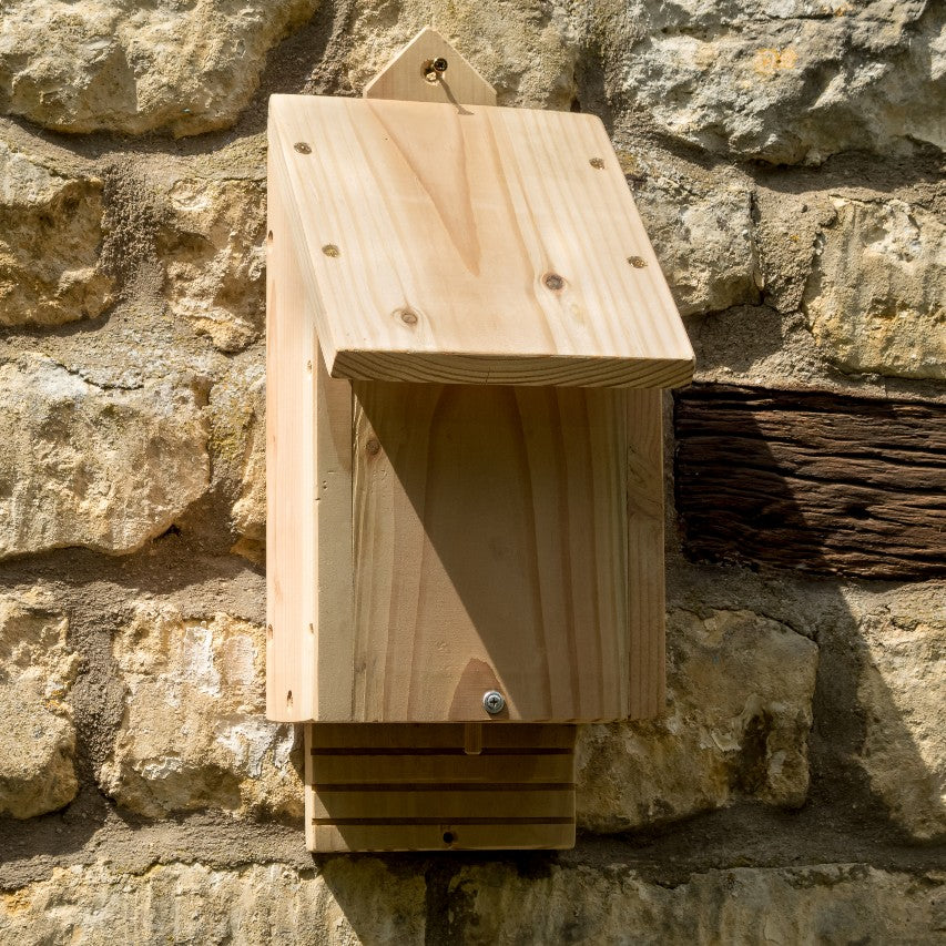 Bat nesting box attached to stone wall