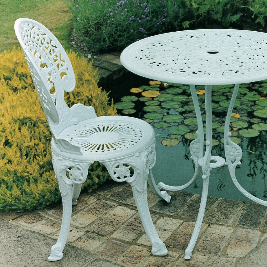 Jardine Leisure Coalbrookdale chair in gloss white finish standing on patio next to garden pond