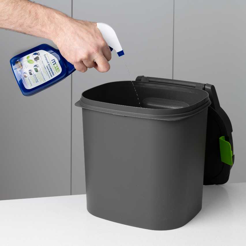 Bokashi bin being sprayed