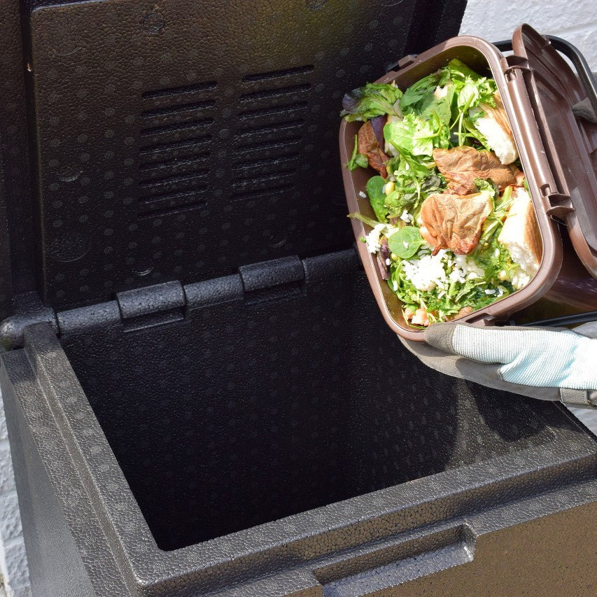 Kitchen waste being emptied into hotbin